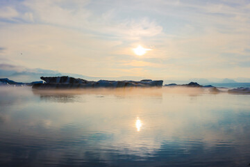 Fog on the Jokulsarlon glacier lagoon in Iceland at sunset in June 