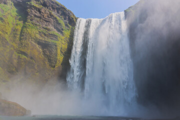 Skogafoss Waterfall in Iceland Europes largest waterfall blue sky black gravel sand 