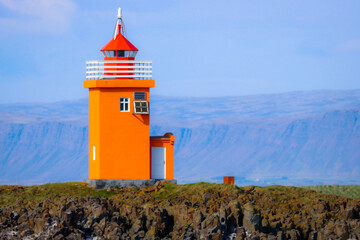 Orange Lighthouse on Island in Iceland 