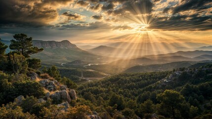 Dramatic sun rays pierce through clouds, illuminating a vast mountain landscape, creating a breathtaking view of nature's beauty..
