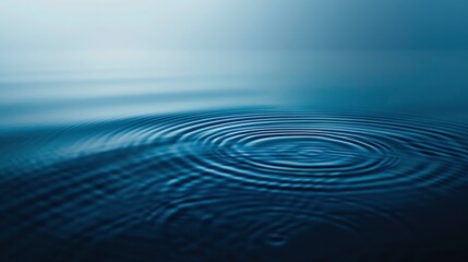 Obraz premium An artistic image capturing a single water ripple expanding under a gradient of blue hues, symbolizing calmness and tranquillity, ai