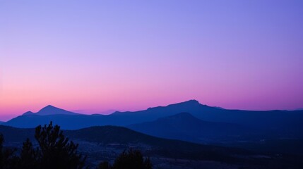 Fototapeta premium Dusk settles softly, blending hues of purple and indigo in the western sky.