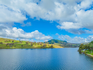 Aerial daytime views over Carcoar Dam with clouds