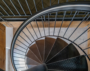 A top-down artistic view of a spiral staircase at Schloss Drachenburg, featuring a striking mix of...