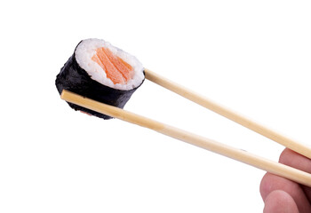 Holding piece of urumaki sushi roll with chopsticks isolated orange background