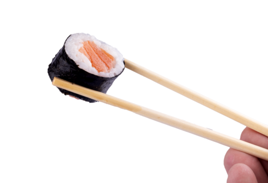 Holding piece of urumaki sushi roll with chopsticks isolated orange background