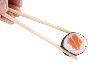Holding piece of urumaki sushi roll with chopsticks isolated