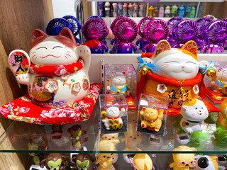 Display of Japanese Lucky Cat Figurines and Other Knick-Knacks