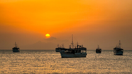 Fototapeta premium Fishing boats in Juan Griego Bay at sunset. Margarita Island, Nueva Esparta State. Venezuela