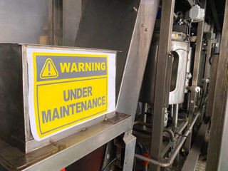 Warning Sign on a Machine Under Maintenance