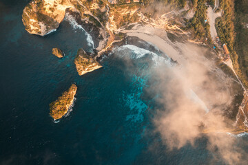 Drone aerial panorama of Diamond Beach in Bali, Indonesia at sunrise