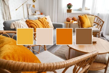 Interior of stylish living room with armchairs, grey sofa and wooden table. Different color patterns