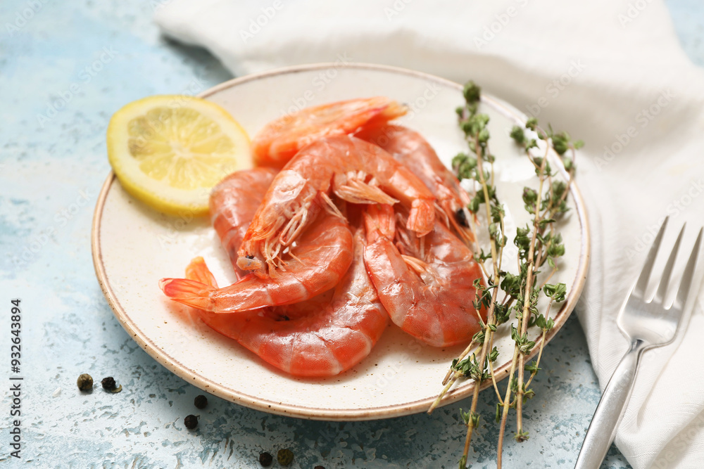 Wall mural plate with tasty boiled shrimps, lemon and peppercorn on light blue background