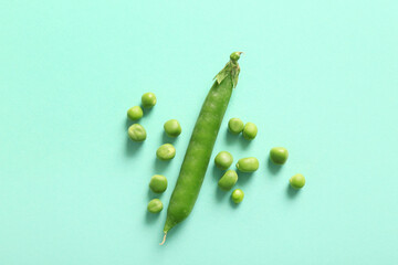 Green peas on turquoise background