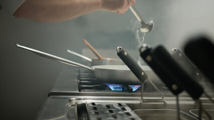 Adding Water To The Pan To Complete The Cooking 