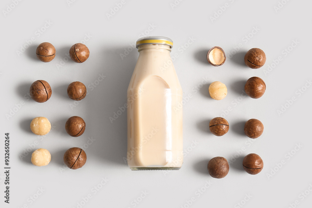 Poster Bottle of fresh macadamia milk on grey background