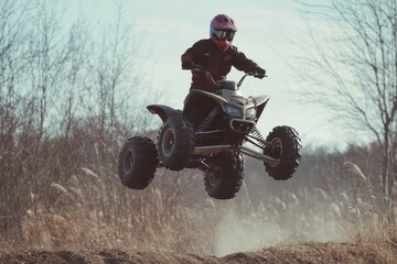 Fototapeta premium Teen on ATV jumping