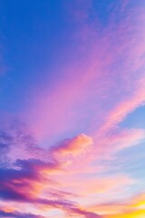 Obraz premium Captivating Sunset Sky with Pastel Colors, Blue and Purple Hues, and Pink Clouds, Creating a Serene and Vibrant Sunset Background