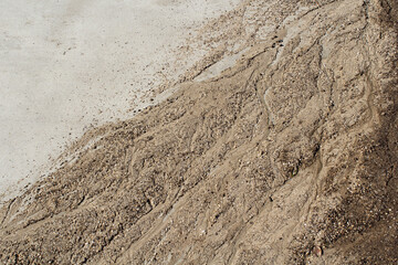 Dirt mud washed up on a concrete surface