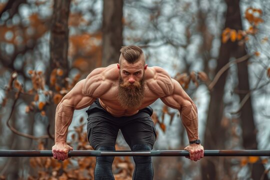 Male athlete trains rigorously with parallel bars pushing his limits