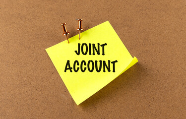 JOINT ACCOUNT text on yellow sticky on board background