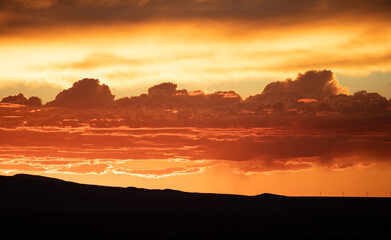 Close up orange clouds sunset in the mountains 