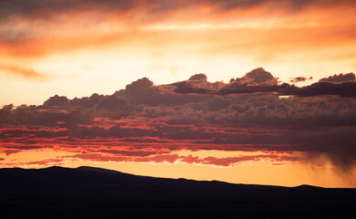 Sunset reflecting on clouds like water, red 