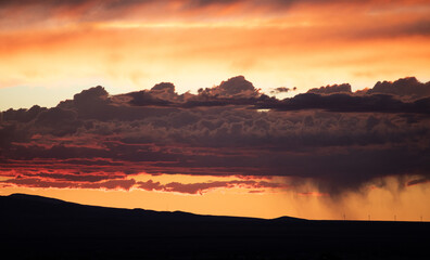 Sunset over the mountains reflecting like a lake