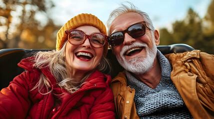 Cheerful elderly couple enjoying a joyful moment outdoors.
