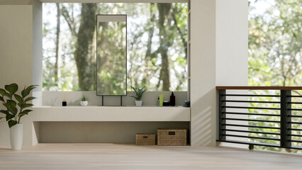 The interior design of a luxurious contemporary bathroom features a scenic view through a balcony.