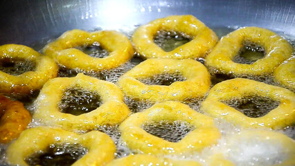 Street food preparation - traditional Peruvian sweets picarones.