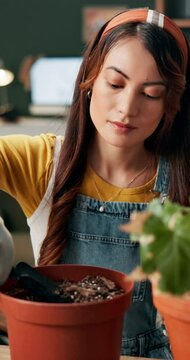 Gardening, spade or woman with soil in home for agriculture sustainability, eco friendly gardner and ecology. Hobby, pot or girl florist planting flower with fertilizer for leaf growth or maintenance