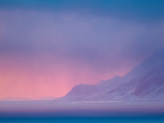 Sunset over the Isfjorden during winter on the island of Spitsbergen in the Svalbard Archipelago. Arctic, Norway.