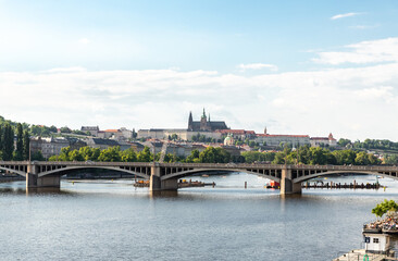Obraz premium Irasekov Bridge on the Vltava River and the Nova Strana district visible in the distance in Prague in Czech Republic