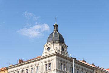 Obraz premium Decorated top of an old building on the embankment in Prague in Czech Republic