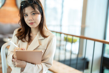 The female executive used her laptop extensively in the office to draft business proposals and...