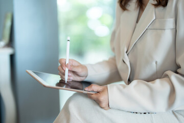 The female executive’s laptop was a vital asset in her office, enabling her to handle various...