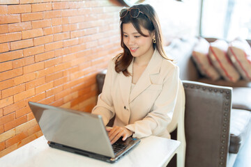 The female executive’s office was a hive of activity, with her laptop being the central tool for...