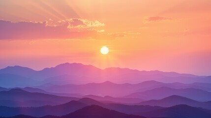 Obraz premium Radiant orange and pink hues fill the sky as the sun sets behind distant mountains, casting a warm glow over the landscape.