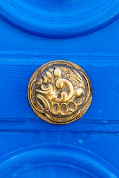 Tunis, Tunisia. Brass door knob on a blue door on a house near the Tunis Souk.
