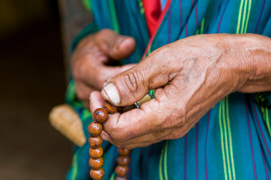 Hands holding chain, Close-up, Chimi Lhakhang, Bhutan