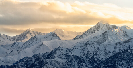 India, Ladakh, Leh, Himalaya Mountains. The mountains around the town of Leh are lit up by the setting sun.