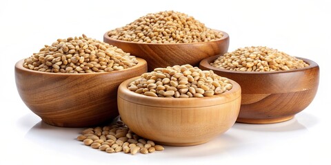 Obraz premium Wheat grains in wooden bowls isolated on a background