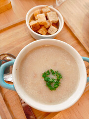 Mushroom soup with bread and fresh mushrooms. top view , autumn seasonal cream soup with vegetables