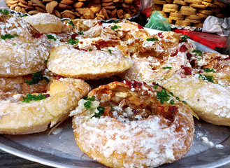 selling traditional sweet dish khajauli or Khaja at matia mahal