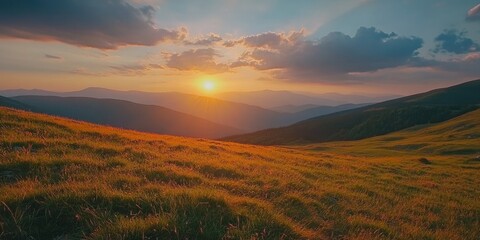 Sunset over grassy hill