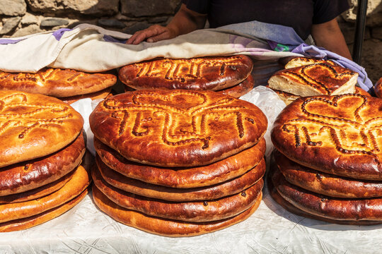 Armenia, Ararat Province, Goght. Ornately decorated Gata (sweet bread) for sale.