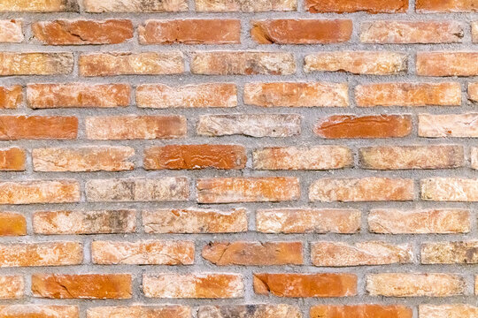 Netherlands, South Holland, Delft. Patterns in a red brick wall.