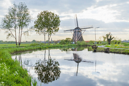 Netherlands, Utrecht, Abcoude. Traditional windmill on a Dutch canal.
