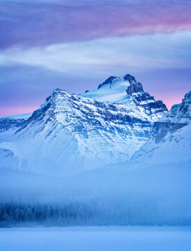 Canada, Alberta, Banff National Park, Dusk and fog at Mount Hector and Bow Lake